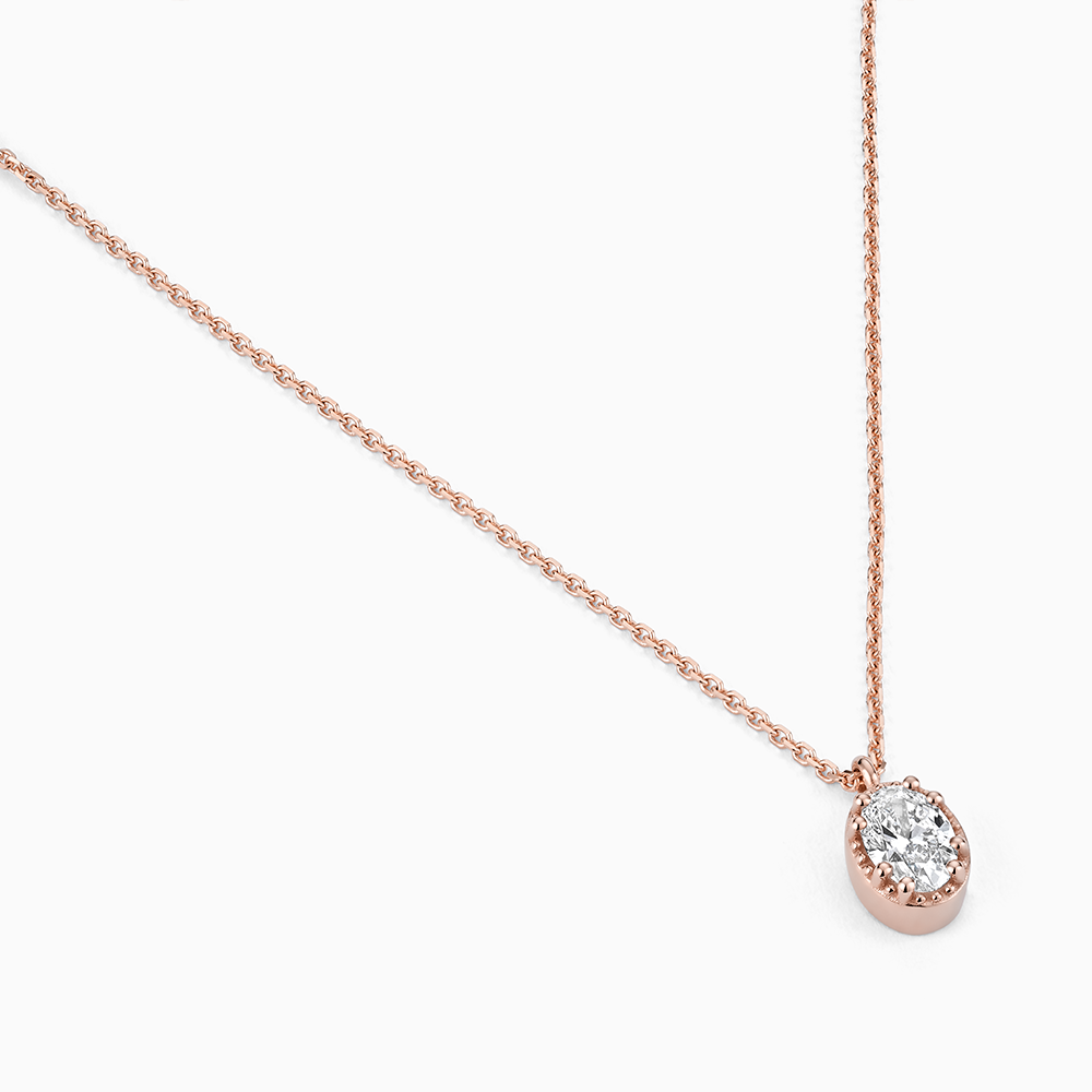 Angled view of Ecksand's Oval Diamond Stackable Necklace with Milgrain Halo in 18k Rose Gold, Lab-grown VS2+/F+