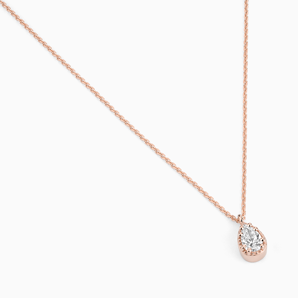 Angled view of Ecksand's Pear Diamond Stackable Necklace with Milgrain Halo in 18k Rose Gold, Lab-grown VS2+/F+