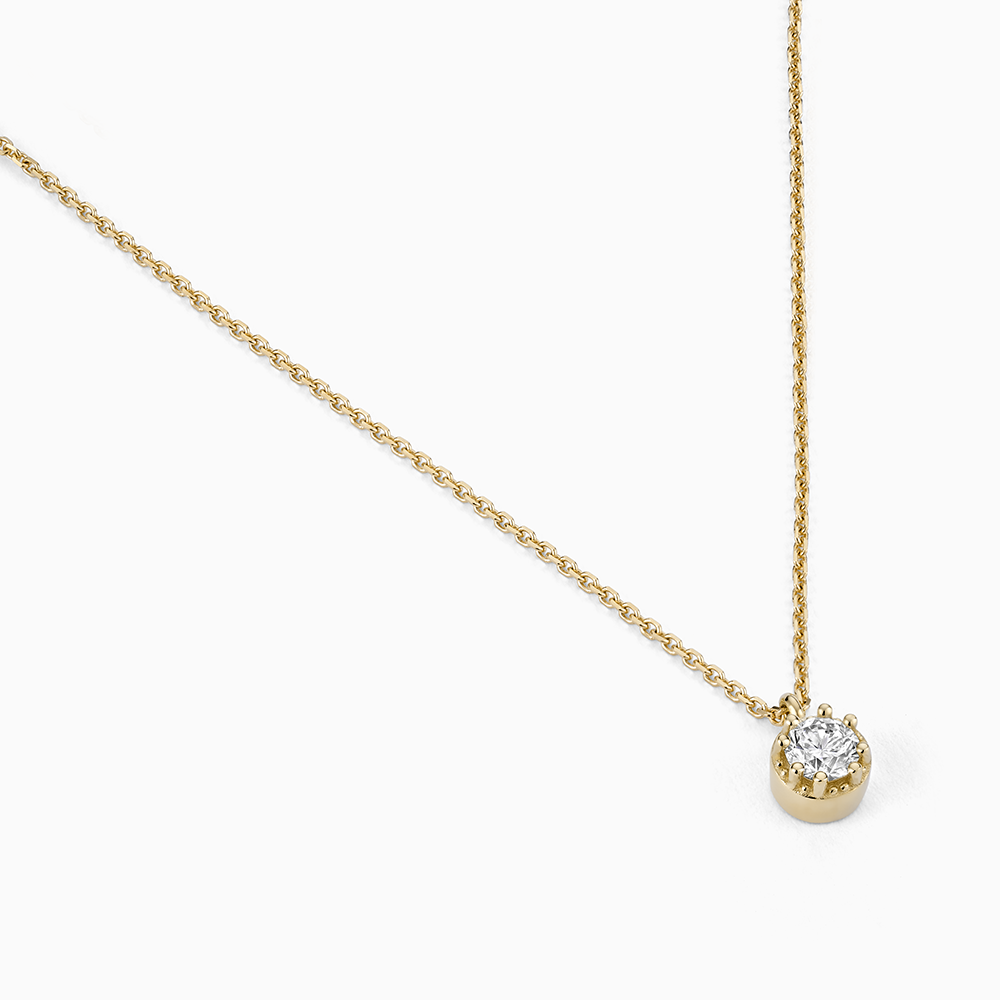 Angled view of Ecksand's Round Diamond Stackable Necklace with Milgrain Halo in 18k Yellow Gold, Lab-grown VS2+/F+