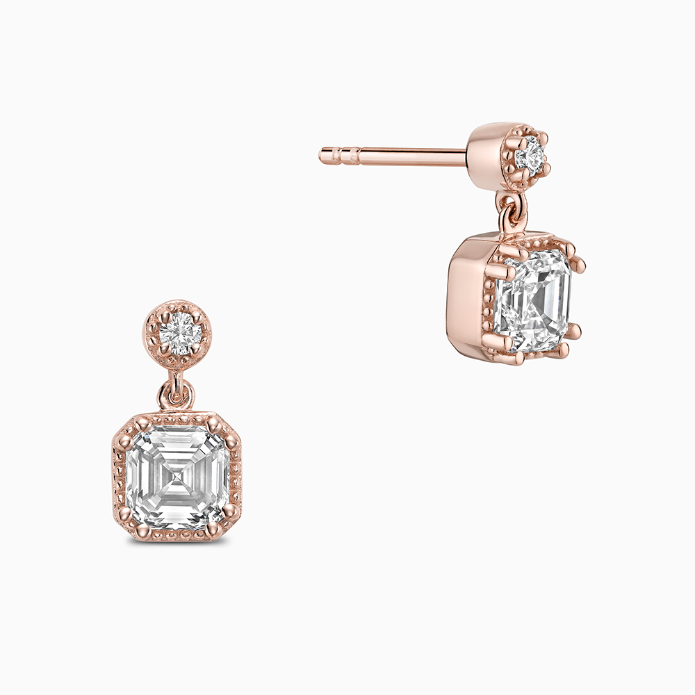 Face view of Ecksand's Asscher Diamond Stud Earrings with Milgrain Halo and Diamond Accent in 18k Rose Gold, Lab-grown VS2+/ F+