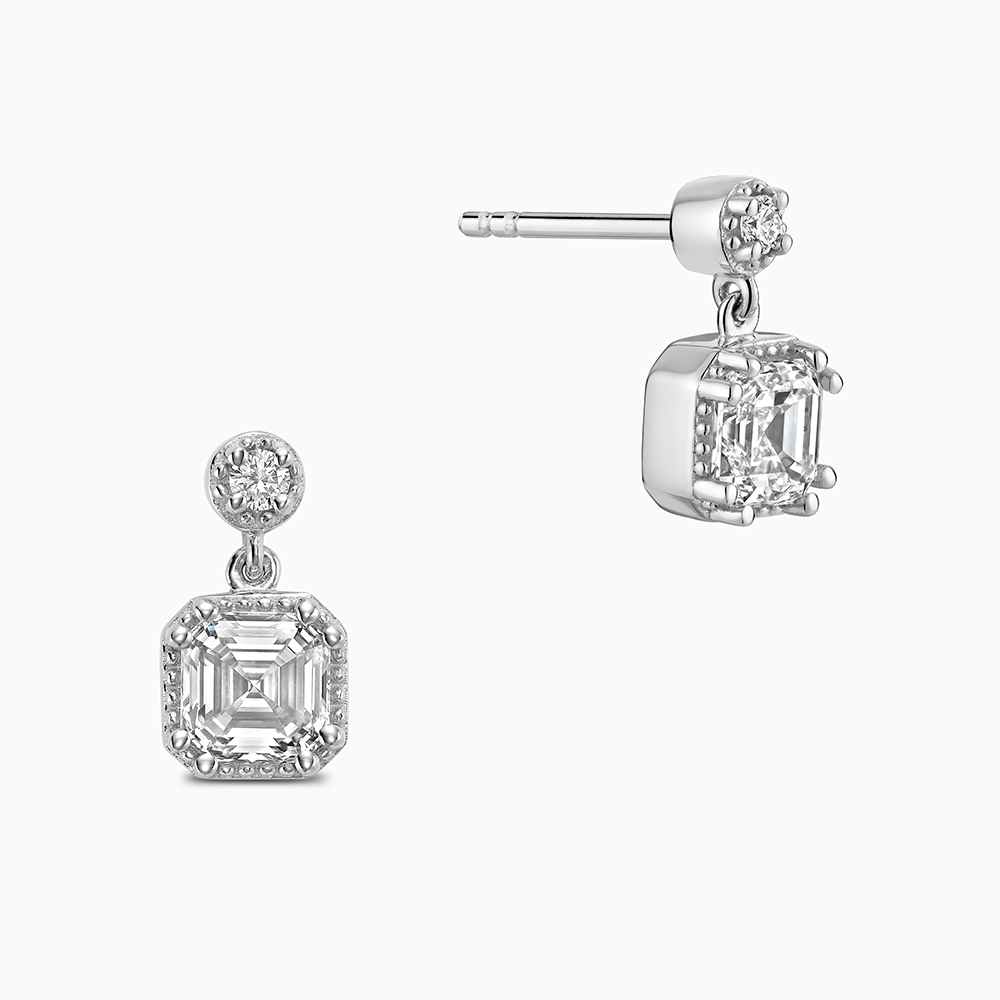 Face view of Ecksand's Asscher Diamond Stud Earrings with Milgrain Halo and Diamond Accent in 18k White Gold, Lab-grown VS2+/ F+