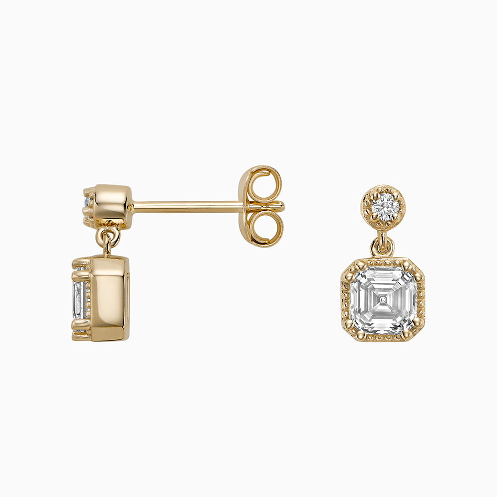 Angled view of Ecksand's Asscher Diamond Stud Earrings with Milgrain Halo and Diamond Accent in 18k Yellow Gold, Lab-grown VS2+/ F+