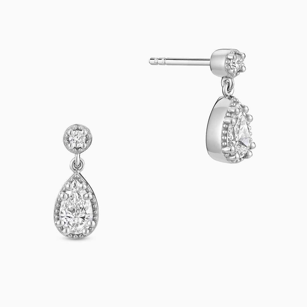 Face view of Ecksand's Pear Diamond Stud Earrings with Milgrain Halo and Diamond Accent in 18k White Gold, Lab-grown VS2+/ F+