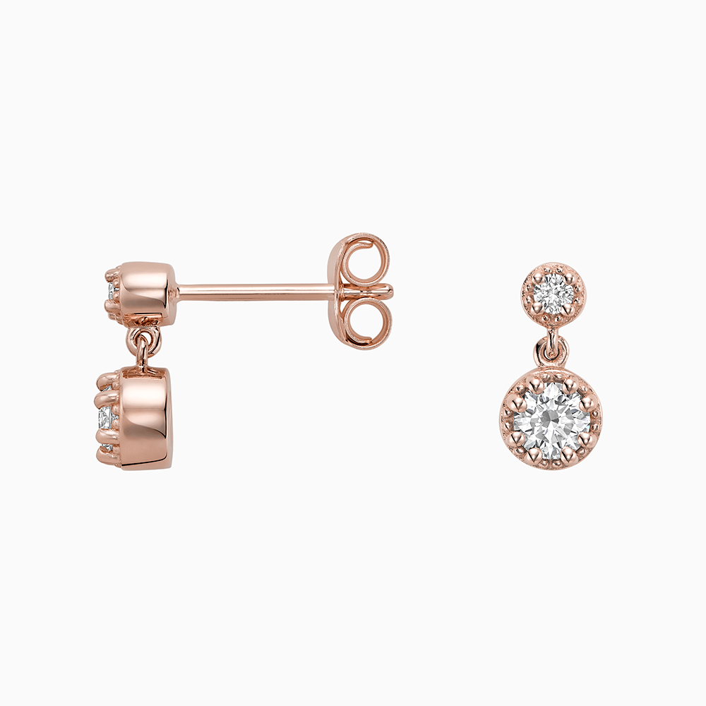 Angled view of Ecksand's Round Diamond Stud Earrings with Milgrain Halo and Diamond Accent in 18k Rose Gold, Lab-grown VS2+/ F+