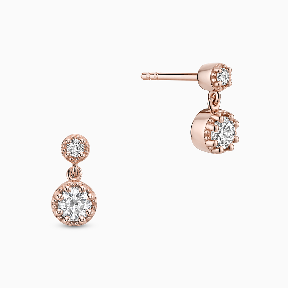 Face view of Ecksand's Round Diamond Stud Earrings with Milgrain Halo and Diamond Accent in 18k Rose Gold, Lab-grown VS2+/ F+