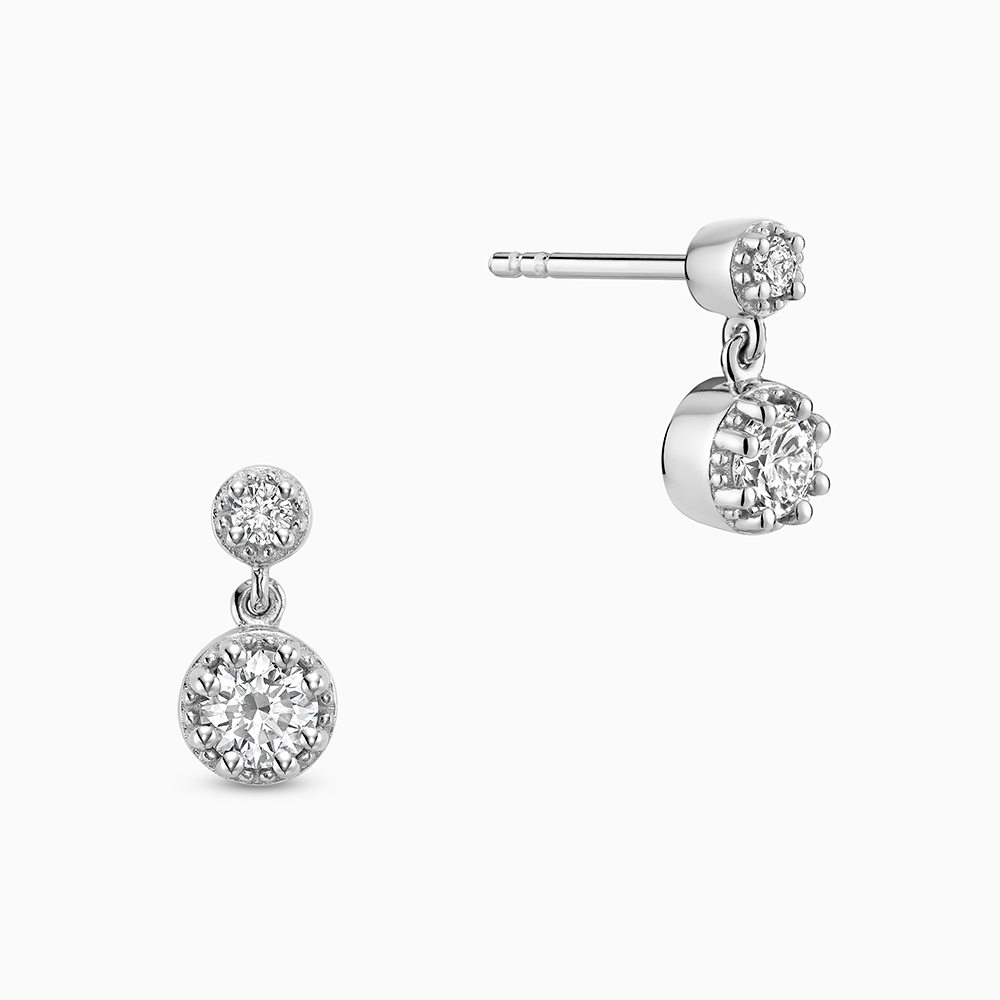 Face view of Ecksand's Round Diamond Stud Earrings with Milgrain Halo and Diamond Accent in 18k White Gold, Lab-grown VS2+/ F+