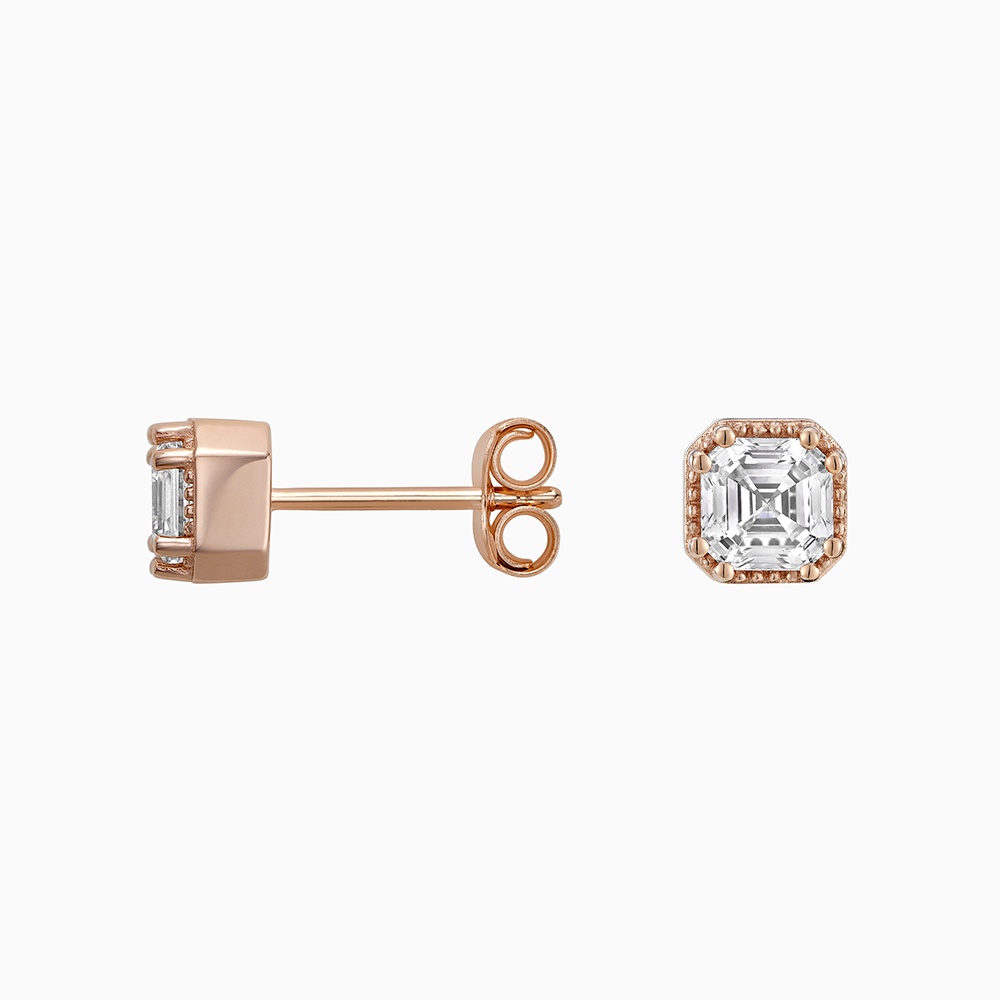 Angled view of Ecksand's Asscher Diamond Stud Earrings with Milgrain Halo in 18k Rose Gold, Lab-grown VS2+/ F+