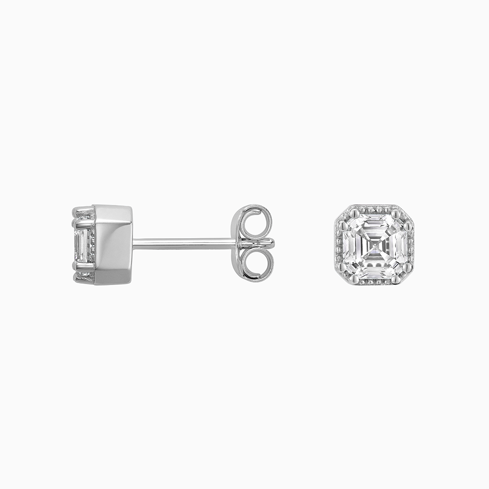 Angled view of Ecksand's Asscher Diamond Stud Earrings with Milgrain Halo in 18k White Gold, Lab-grown VS2+/ F+