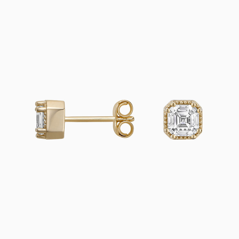 Angled view of Ecksand's Asscher Diamond Stud Earrings with Milgrain Halo in 18k Yellow Gold, Lab-grown VS2+/ F+