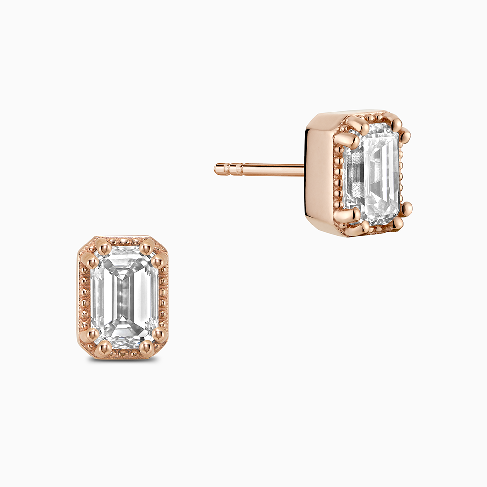 Face view of Ecksand's Emerald Diamond Stud Earrings with Milgrain Halo in 18k Rose Gold, Lab-grown VS2+/ F+