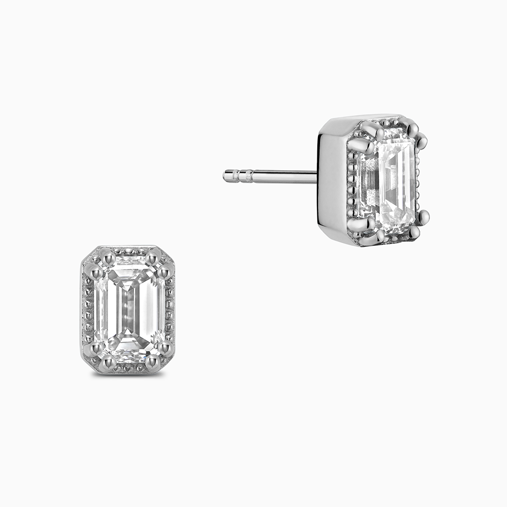 Face view of Ecksand's Emerald Diamond Stud Earrings with Milgrain Halo in 18k White Gold, Lab-grown VS2+/ F+