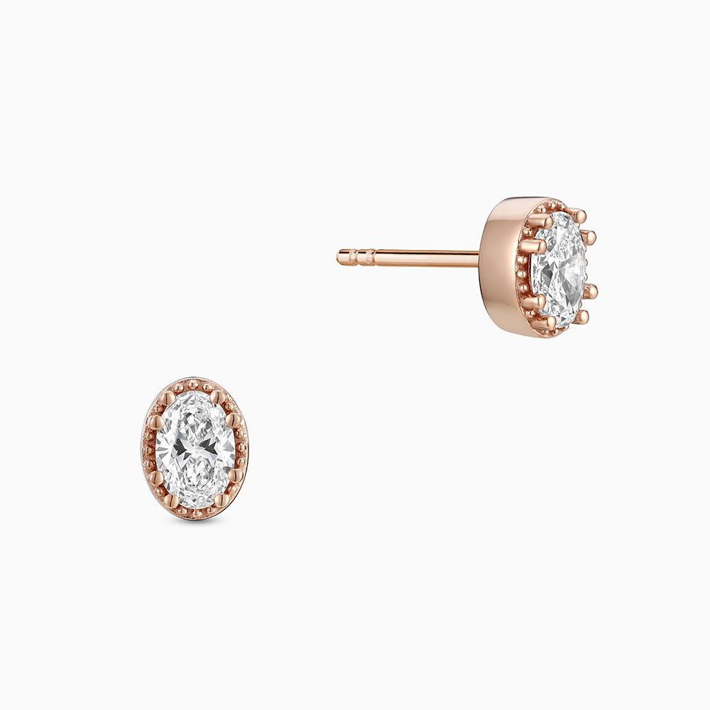 Face view of Ecksand's Oval Diamond Stud Earrings with Milgrain Halo in 18k Rose Gold, Lab-grown VS2+/ F+