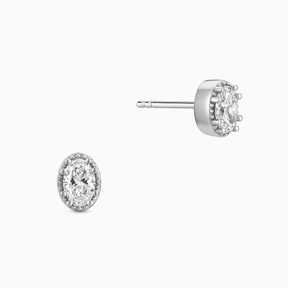 Face view of Ecksand's Oval Diamond Stud Earrings with Milgrain Halo in 18k White Gold, Lab-grown VS2+/ F+