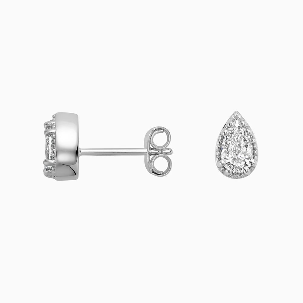 Angled view of Ecksand's Pear Diamond Stud Earrings with Milgrain Halo in 18k White Gold, Lab-grown VS2+/ F+