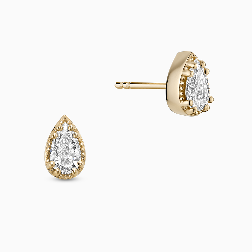 Face view of Ecksand's Pear Diamond Stud Earrings with Milgrain Halo in 18k Yellow Gold, Lab-grown VS2+/ F+