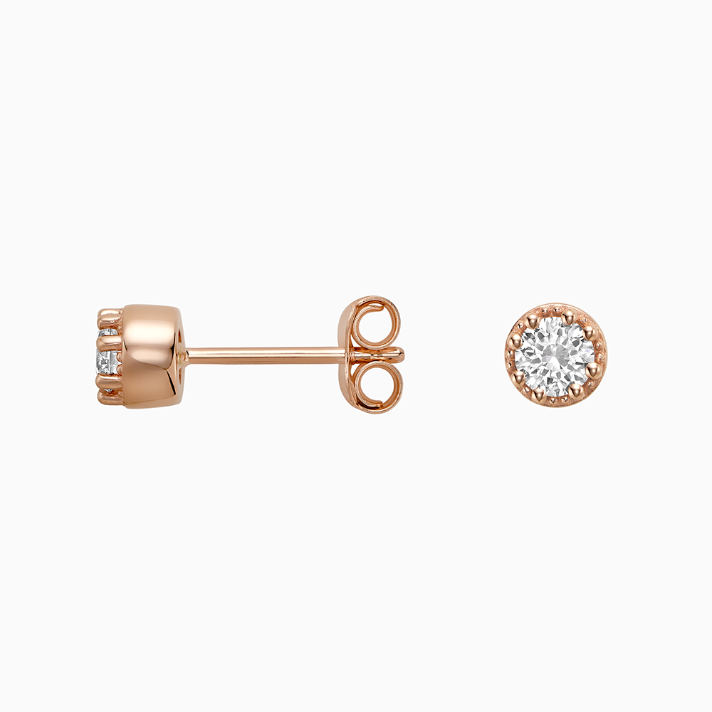 Angled view of Ecksand's Round Diamond Stud Earrings with Milgrain Halo in 18k Rose Gold, Lab-grown VS2+/ F+