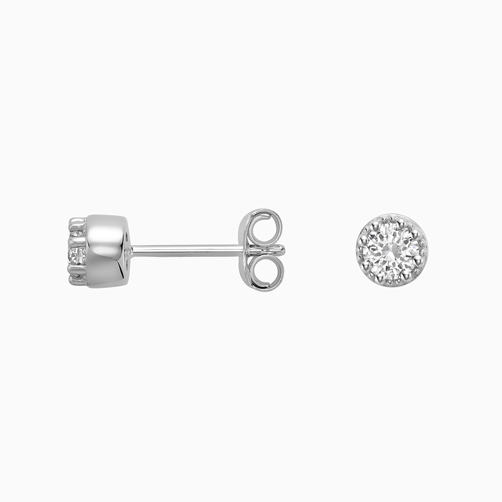 Angled view of Ecksand's Round Diamond Stud Earrings with Milgrain Halo in 18k White Gold, Lab-grown VS2+/ F+