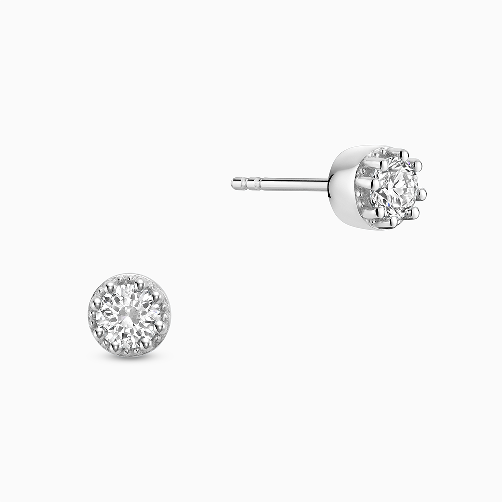 Face view of Ecksand's Round Diamond Stud Earrings with Milgrain Halo in 18k White Gold, Lab-grown VS2+/ F+