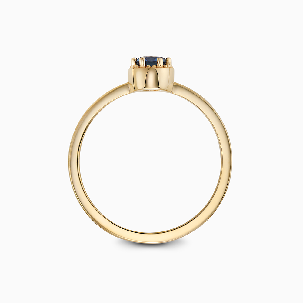 Profile view of Ecksand's Round Blue Sapphire Stackable Ring with Milgrain Halo in 18k Yellow Gold