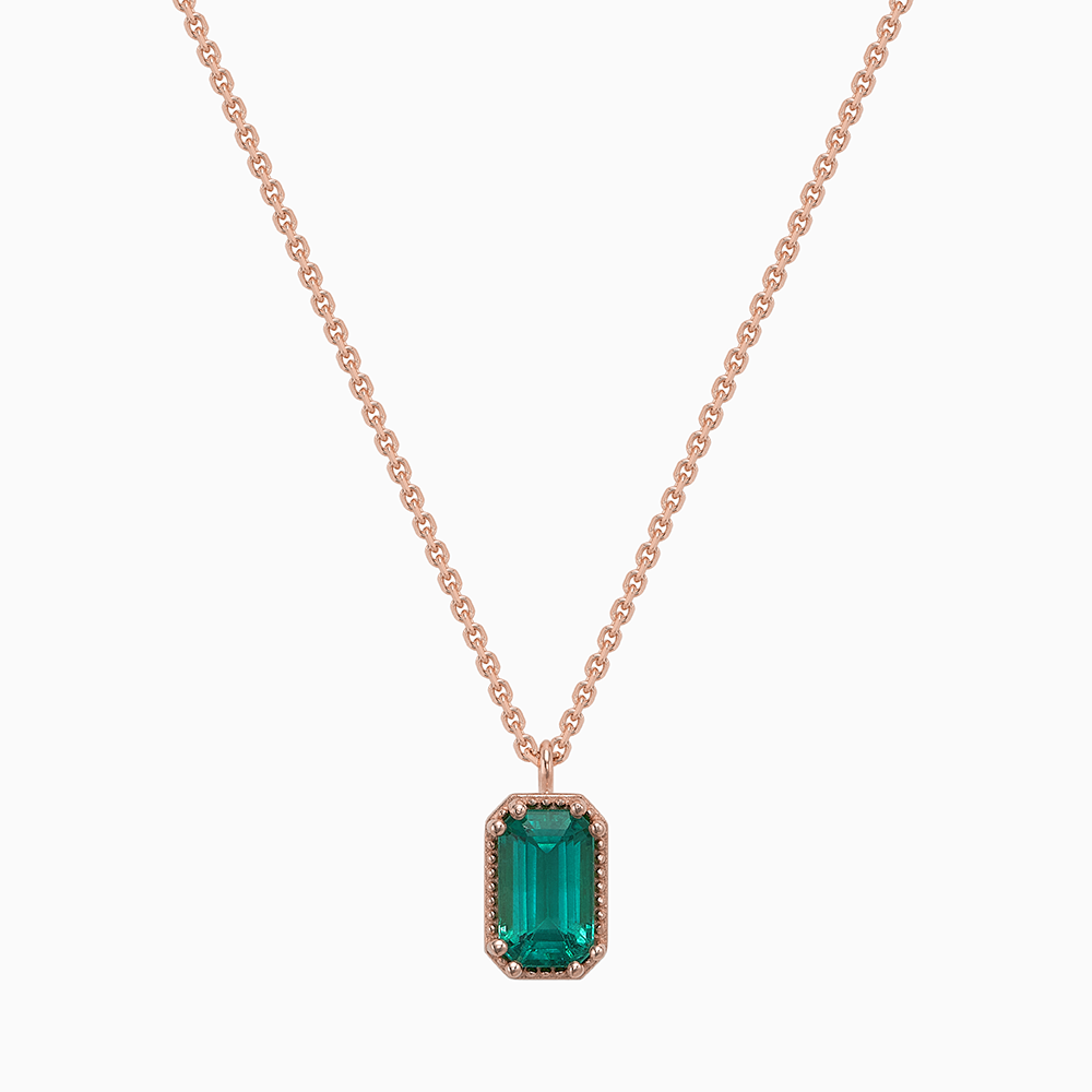 Face view of Ecksand's Emerald Stackable Necklace with Milgrain Halo in 18k Rose Gold