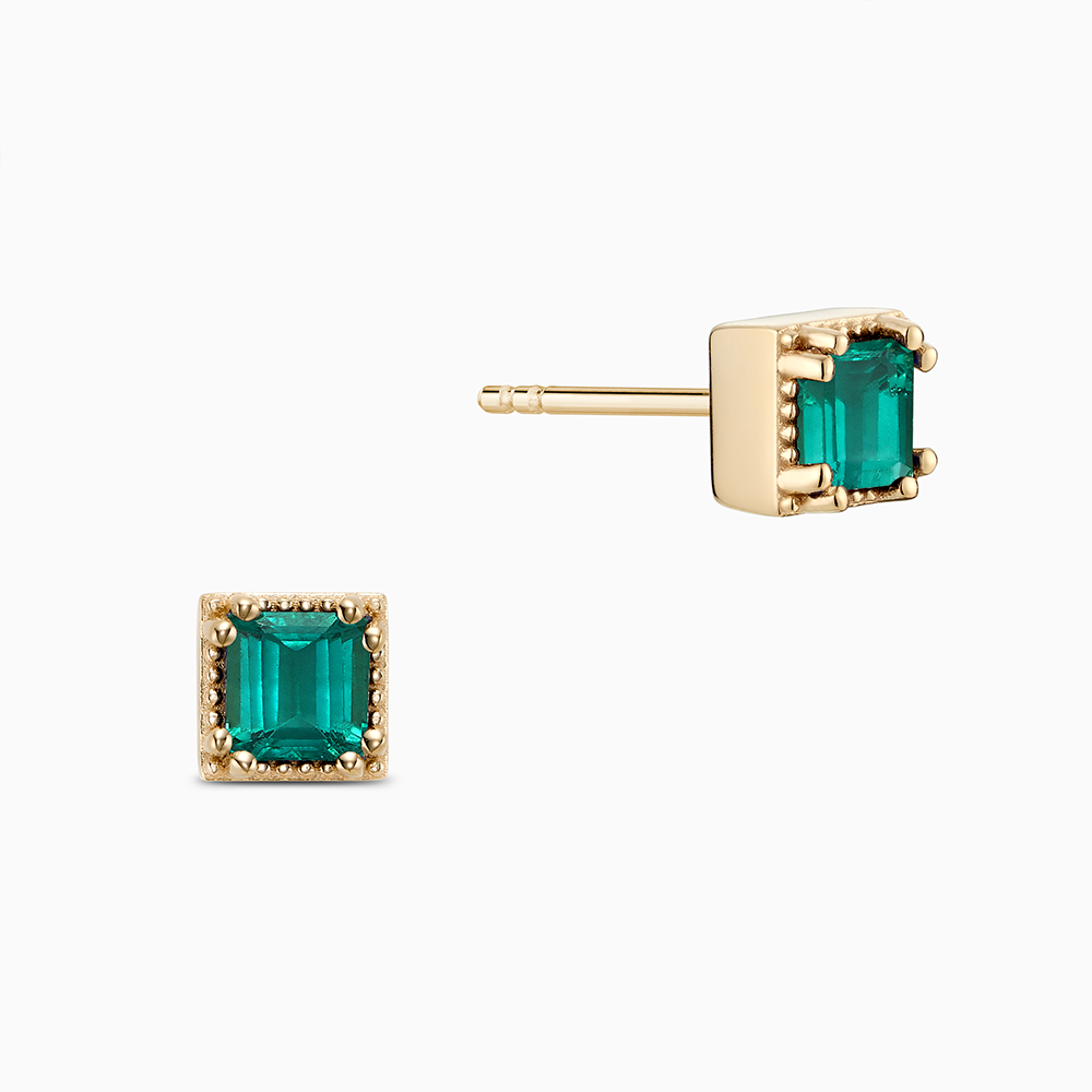 Face view of Ecksand's Asscher Emerald Stud Earrings with Milgrain Halo in 18k Yellow Gold