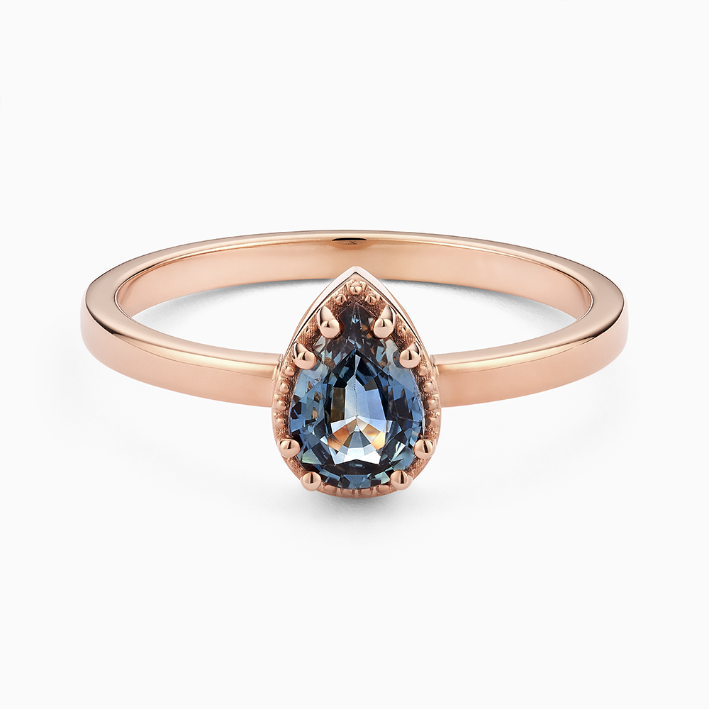 Face view of Ecksand's Pear Montana Sapphire Stackable Ring with Milgrain Halo in 18k Rose Gold