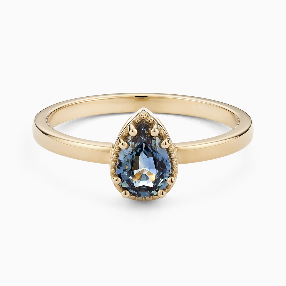 Face view of Ecksand's Pear Montana Sapphire Stackable Ring with Milgrain Halo in 18k Yellow Gold