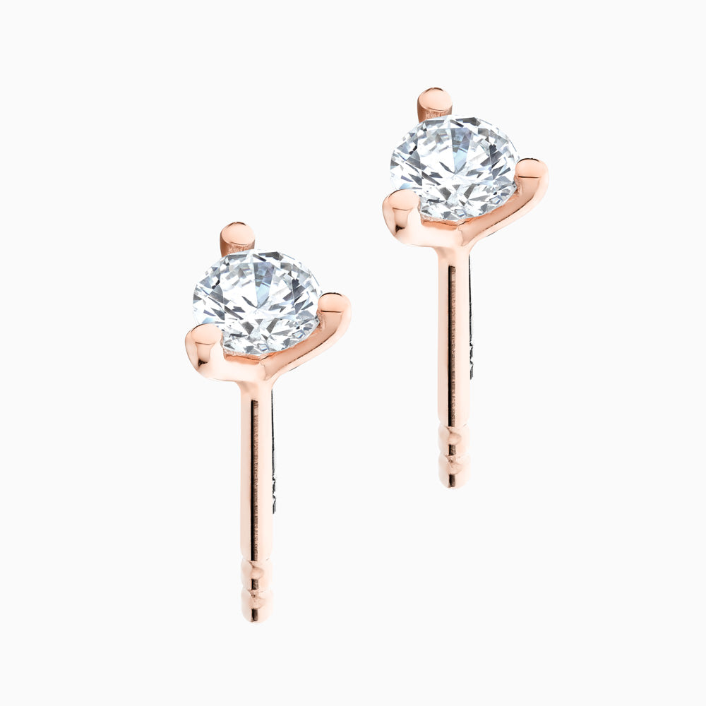 The Ecksand Three-Prong Diamond Stud Earrings shown with  in 