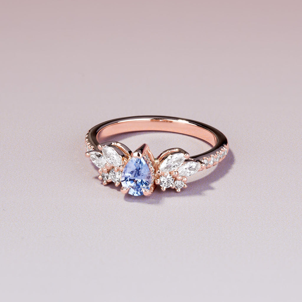 The Ecksand Cluster Engagement Ring with Blue Sapphire and Hidden Halo shown with  in 