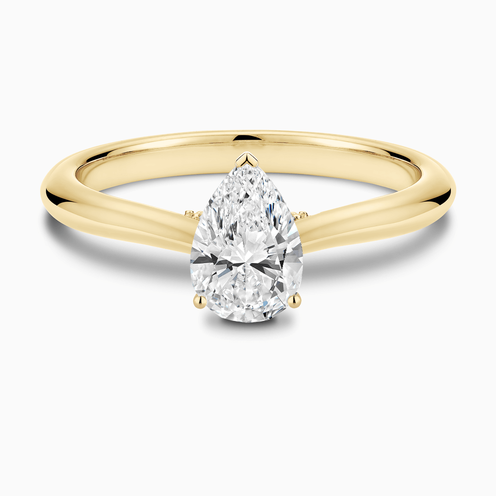 The Ecksand Cathedral-Setting Diamond Engagement Ring with Diamond Bridge shown with Pear in 18k Yellow Gold
