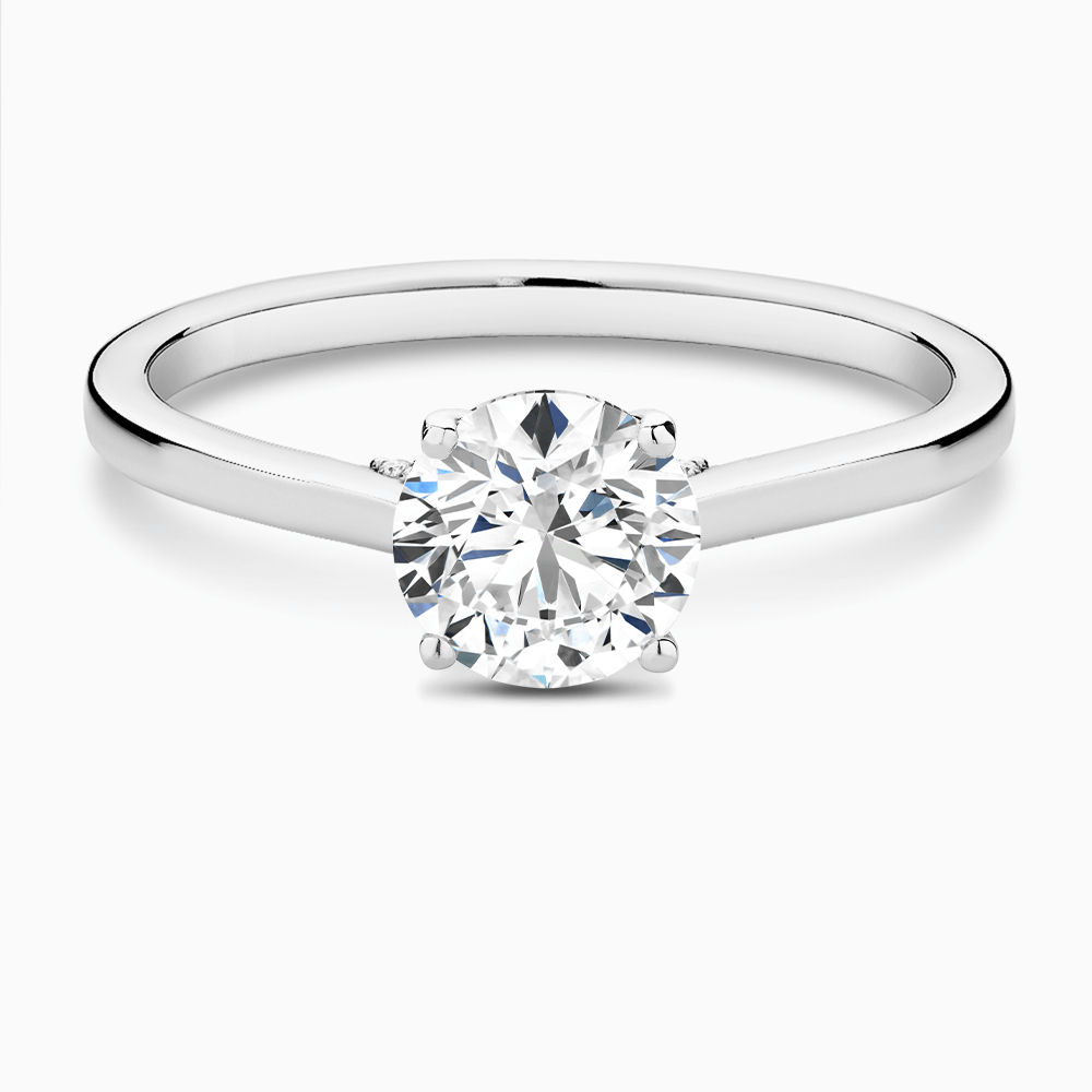 The Ecksand Kaila's Solitaire Engagement Ring with Diamond Pavé Bridge and Hidden Diamond shown with  in 