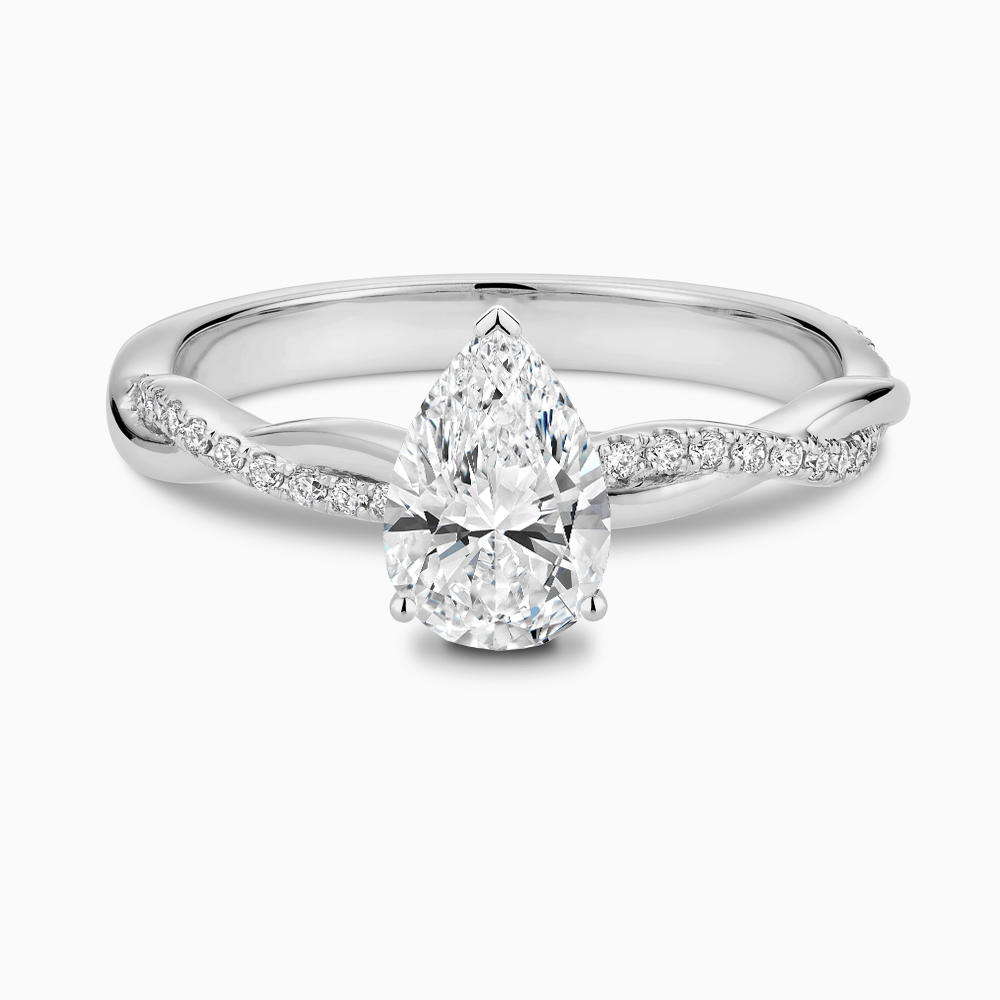 The Ecksand Iconic Diamond Engagement Ring with Secret Heart and Twisted Diamond Band shown with Pear in 18k White Gold