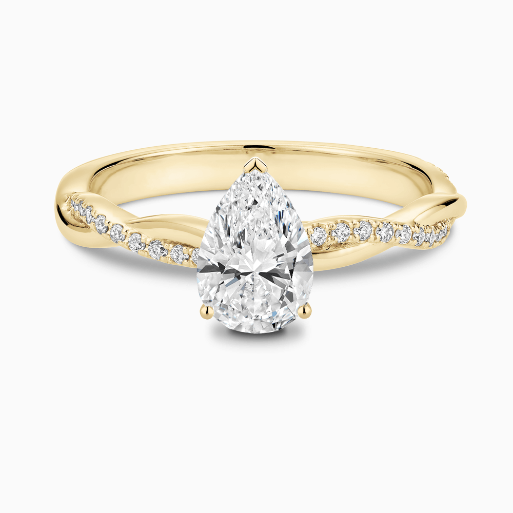 The Ecksand Iconic Diamond Engagement Ring with Secret Heart and Twisted Diamond Band shown with Pear in 18k Yellow Gold