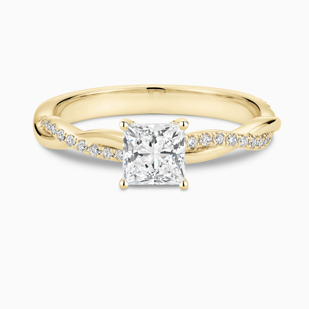 The Ecksand Iconic Diamond Engagement Ring with Secret Heart and Twisted Diamond Band shown with Princess in 18k Yellow Gold