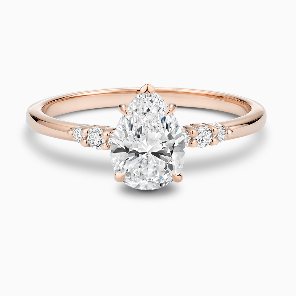 The Ecksand Engagement Ring with Eagle Prongs and Side Diamonds shown with Pear in 14k Rose Gold