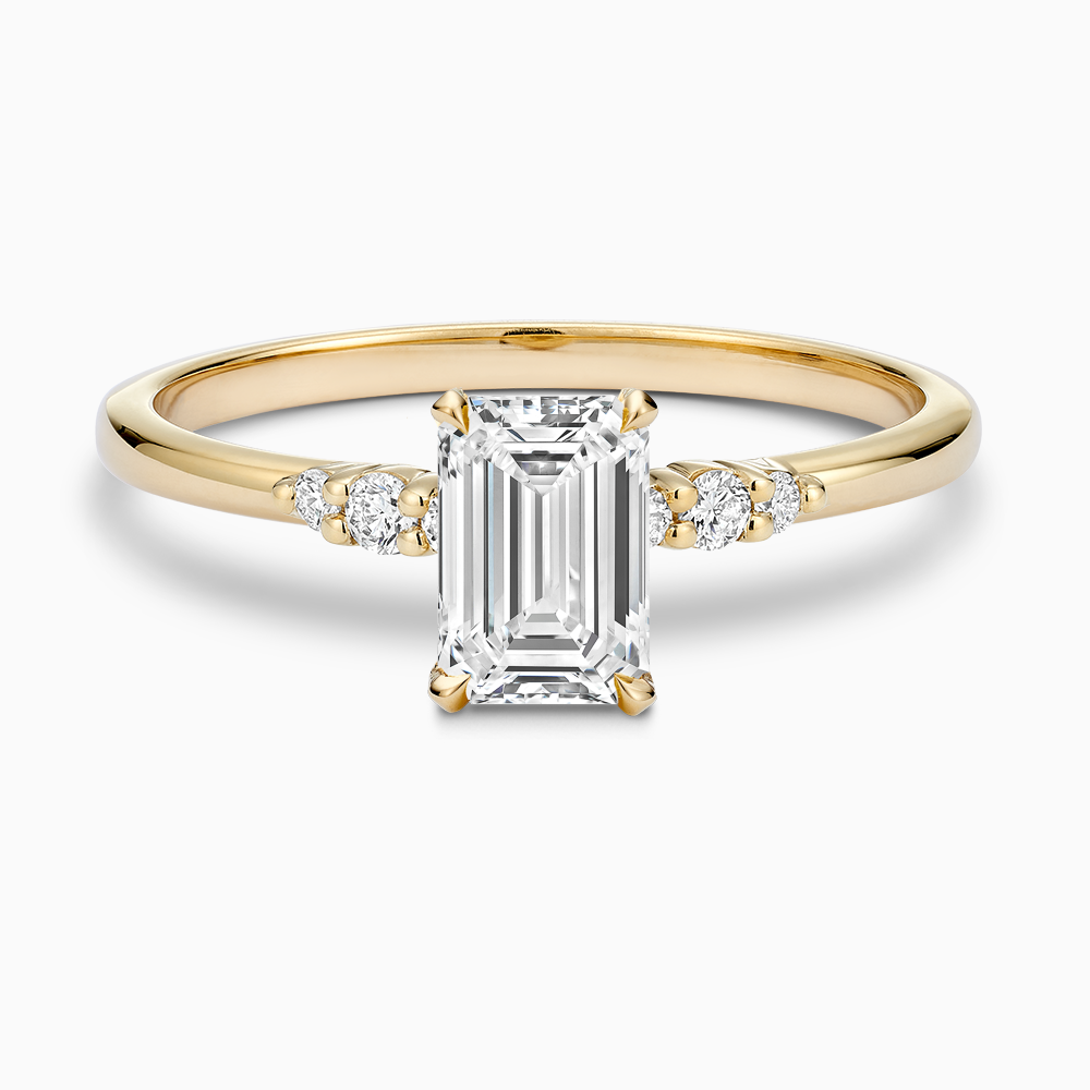 Ecksand's Engagement Ring with Eagle Prongs and Side Diamonds in 18k Yellow Gold, Emerald