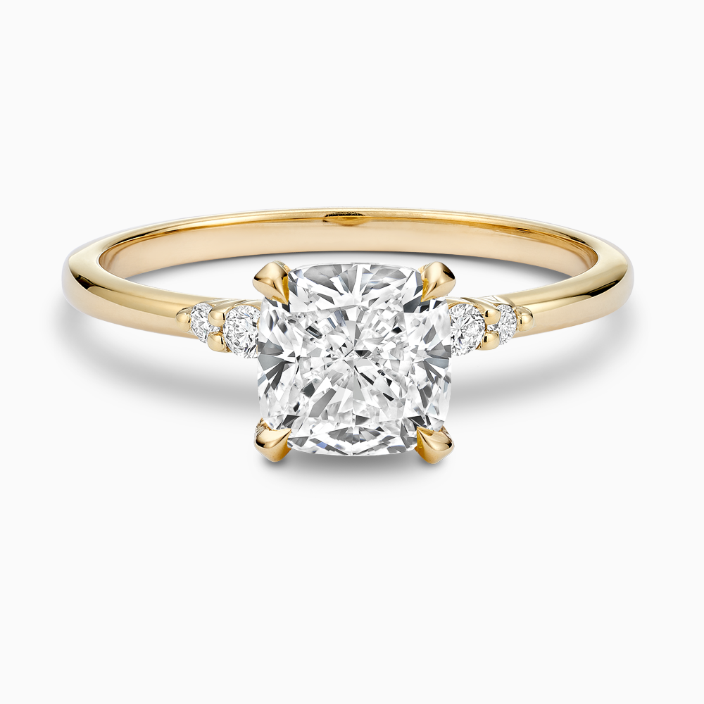 Ecksand's Engagement Ring with Eagle Prongs and Side Diamonds in 18k Yellow Gold, Cushion