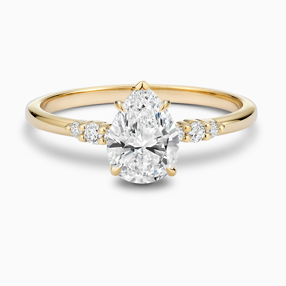 Ecksand's Engagement Ring with Eagle Prongs and Side Diamonds in 18k Yellow Gold, Pear