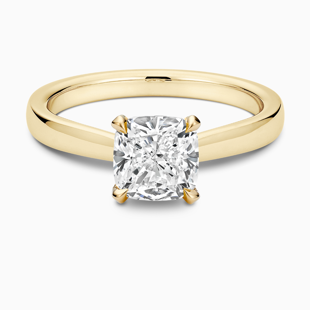 The Ecksand Love-Knot Solitaire Diamond Engagement Ring with Eagle Prongs shown with Cushion in 18k Yellow Gold