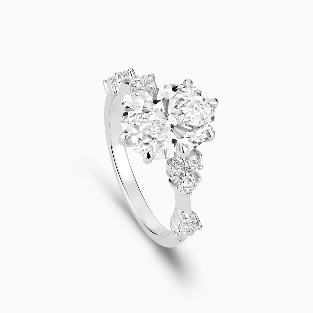 The Ecksand Eight-Prong Blossom Engagement Ring with Side Diamonds shown with  in 