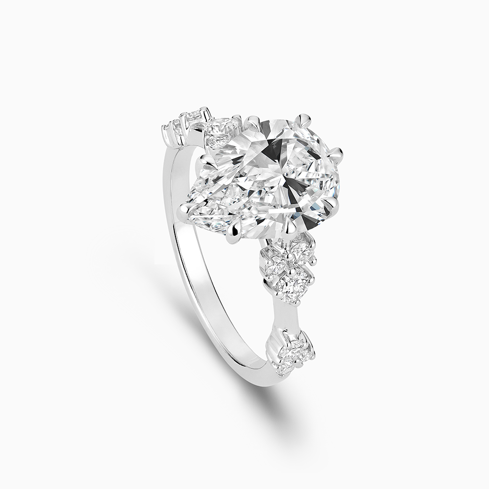 The Ecksand Eight-Prong Blossom Engagement Ring with Side Diamonds shown with  in 