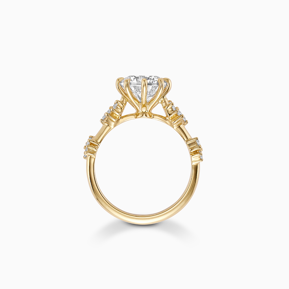 Profile view of Ecksand's Eight-Prong Blossom Engagement Ring with Side Diamonds in 18k Yellow Gold, Princess