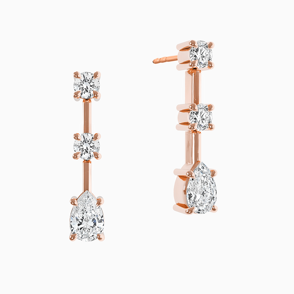 Ecksand Canadian-made diamond dangle earrings in 14K Rose Gold, featuring a pear-cut and two round diamonds.