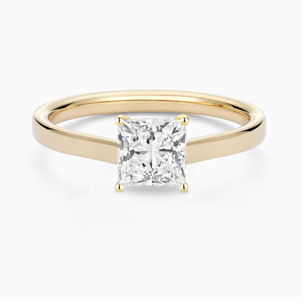 The Ecksand Iconic Hidden Diamond Halo Engagement Ring shown with Princess in 14k Yellow Gold