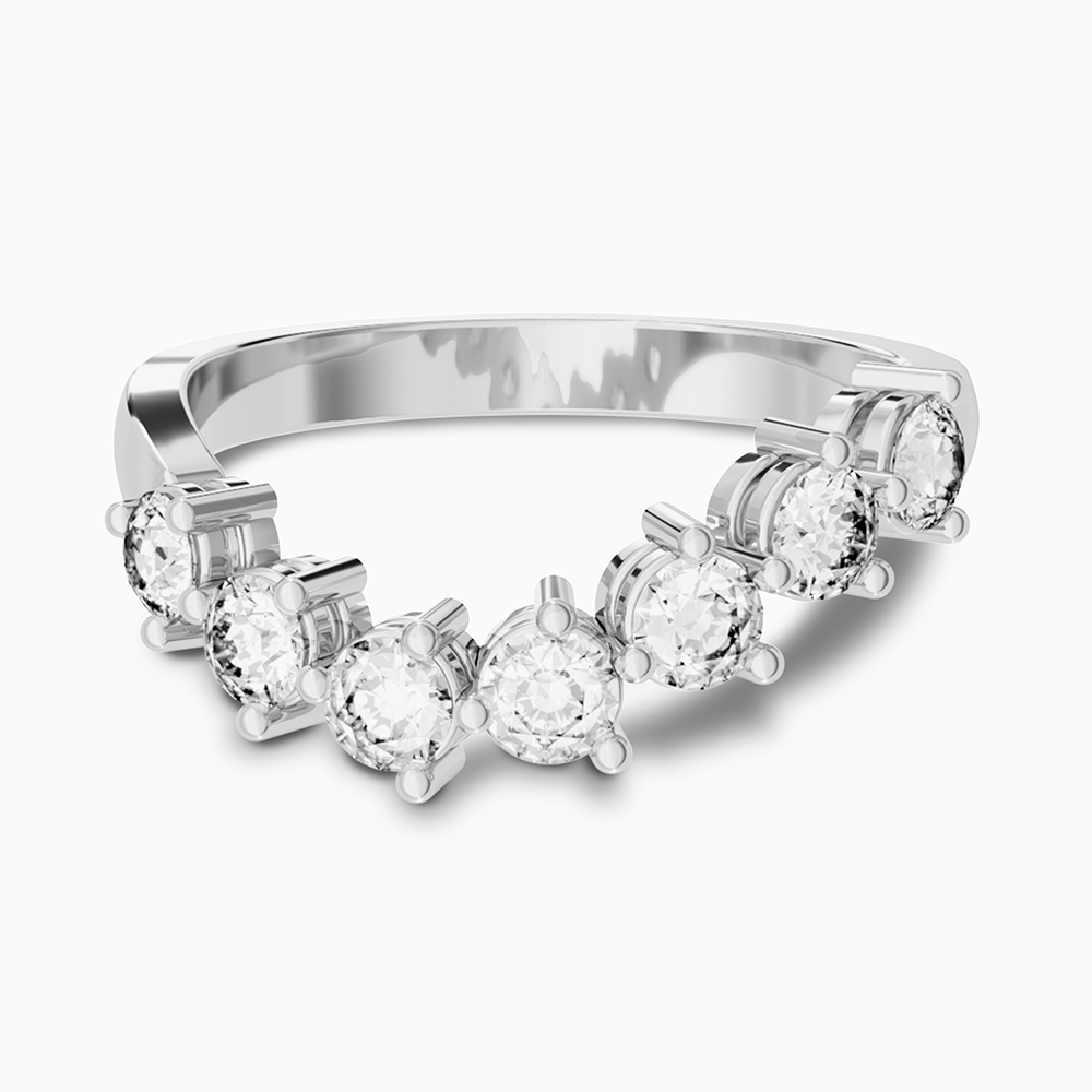 A curved Canadian-made seven-stone diamond wedding ring set in 18K white gold.