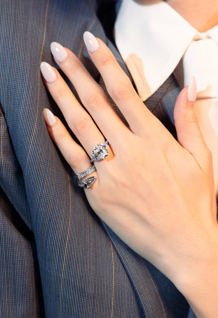 model wearing white gold diamond rings from the ecksand arctic dragon collection