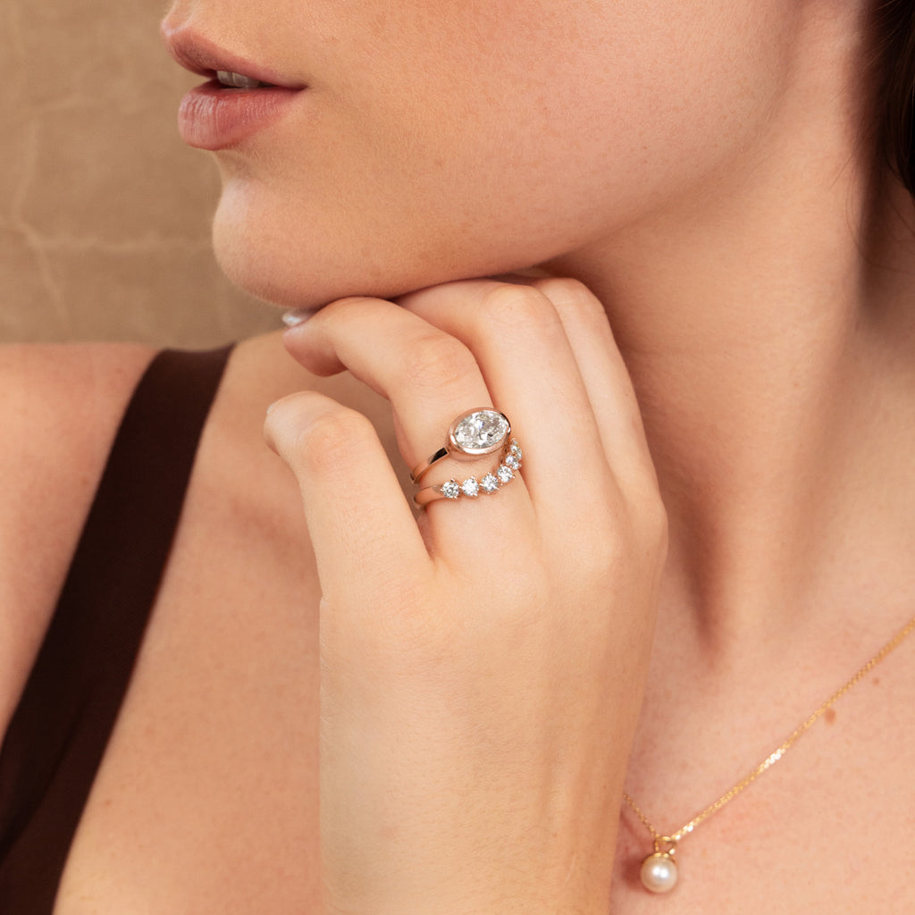 Model wearing a Canadian-made diamond bridal set and an Akoya pearl necklace, all in 18K yellow gold.