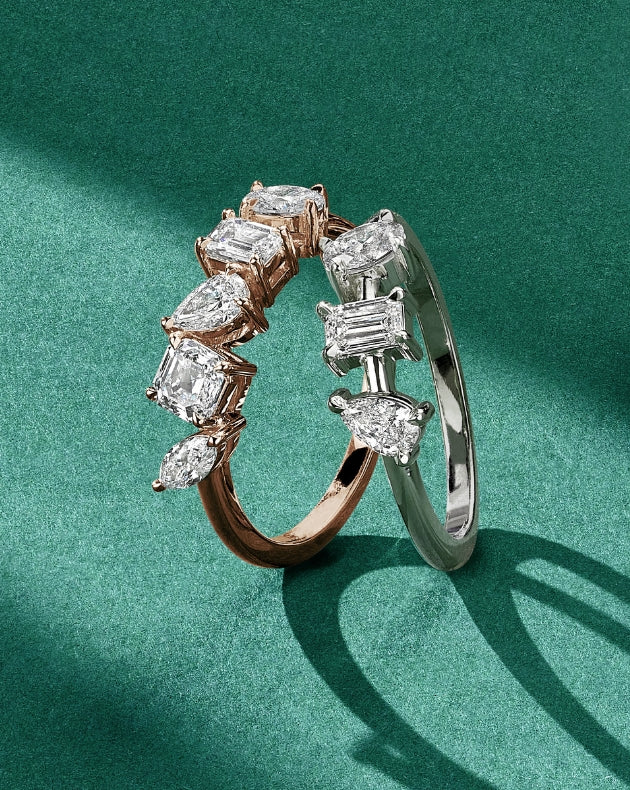 ecksand white and rose gold starlight diamond rings on green background