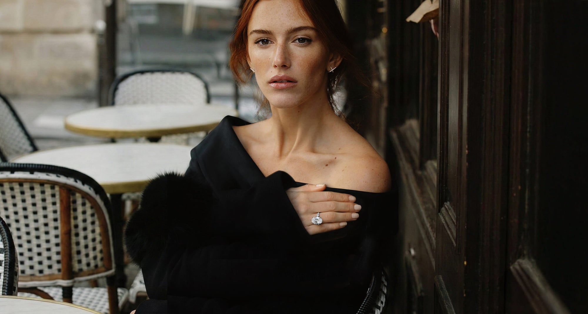 model wearing canadian-made ecksand diamond engagement ring in 18k white gold with a diamond pave band in a black dress paired with x diamond pave stud earrings