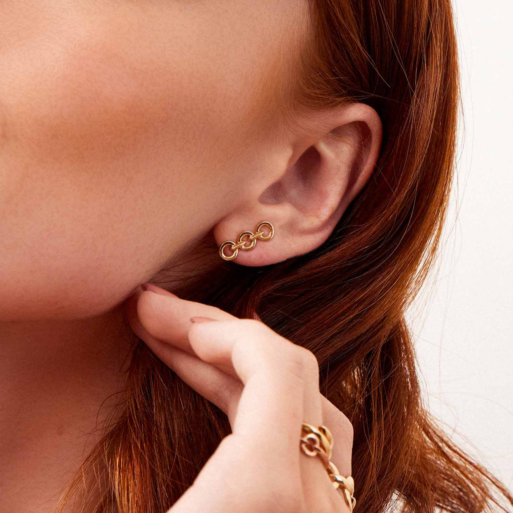 The Ecksand Duel Gold Chain Earrings shown with  in 